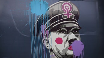 Anti ‘feminazis’ campaign by Spanish ultraconservative group features bus with photo of Hitler in makeup