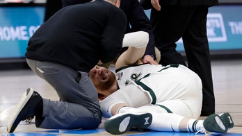 GRAPHIC VIDEO: Michigan State’s Kyle Ahrens lands awkwardly on ankle, taken off court