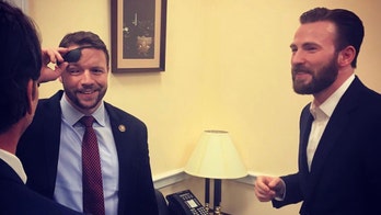Rep. Dan Crenshaw shows off his ‘Captain America’ glass eye to Chris Evans