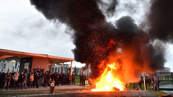 Guards set fire to tires, block gates to 18 prisons in France after 'terror attack'