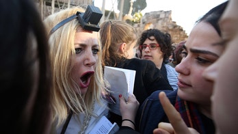 Fights erupt at Jerusalem's Western Wall after ultra-Orthodox Jewish men try to block women's group from praying