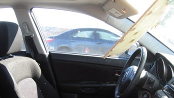 Washington driver escapes death after plywood smashes through windshield