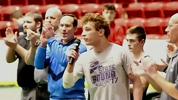 High school wrestler Isaac Bryant's incredible National Anthem performance goes viral