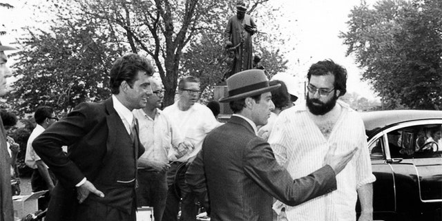 On the set of "The Godfather," baptism day, (L to R) Gianni Russo, Al Pacino and director Francis Ford Coppola.