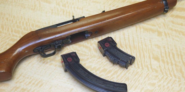FILE: A semi-automatic rifle is displayed with a 25 shot magazine, left, and a 10 shot magazine, right, at a gun store in Elk Grove, Calif.