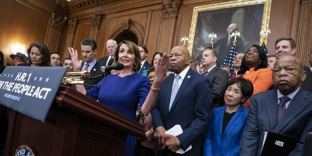 Speaker Nancy Pelosi and House Democrats unveil an elections and ethics reform package at the Capitol in Washington on Jan. 4, 2019. (AP Photo/J. Scott Applewhite)