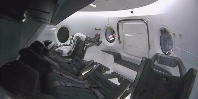 This photo provided by SpaceX shows a test dummy in the new Dragon capsule designed for astronauts. (SpaceX via AP)