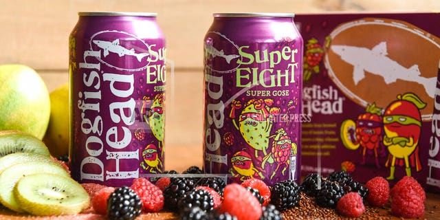 In this undated photo provided by Dogfish Head Craft Brewery, cans of Dogfish's SuperEight beer are displayed on a table in Milton, Del. Kodak says the new beer hitting the market can be used to develop its Super 8 movie film. Dogfish Head Craft Brewery in Delaware created its SuperEIGHT beer after a conversation with people at Kodak, the upstate New York technology company most famous for its photographic roots. (Dogfish Head Craft Brewery via AP)