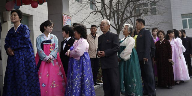People line up to vote during the election at a polling station in Pyongyang, North Korea, Sunday, March 10, 2019. Millions of North Korean voters, including leader Kim Jong Un, are going to the polls to elect roughly 700 members to the national legislature. In typical North Korean style, voters are presented with just one state-sanctioned candidate per district and they cast ballots to show their approval or, very rarely, disapproval.