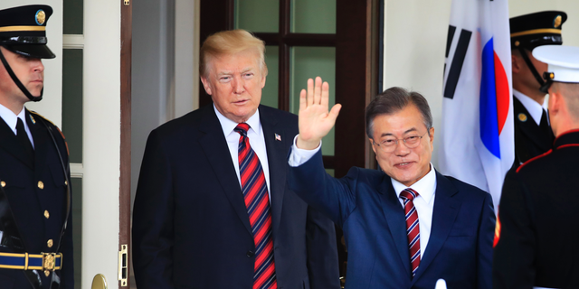FILE - In this May 22, 2018, file photo, South Korean President Moon Jae-in waves as he is welcomed by U.S. President Donald Trump to the White House in Washington. South Korea said on Friday, March 29, 2019, Moon will travel to the United States on April 10-11 to meet with Trump for a summit on North Korean nuclear diplomacy. (AP Photo/Manuel Balce Ceneta, File)