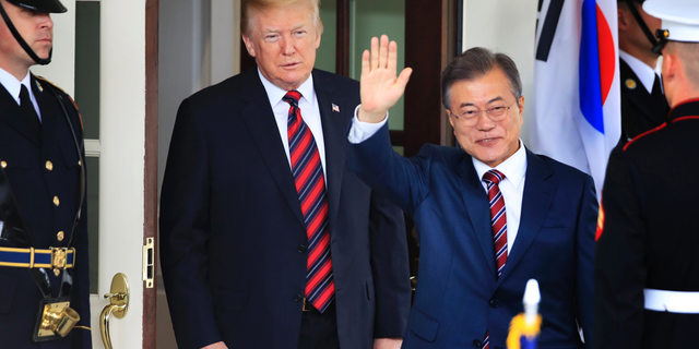 FILE - In this May 22, 2018, file photo, South Korean President Moon Jae-in waves as he is welcomed by U.S. President Donald Trump to the White House in Washington. South Korea said on Friday, March 29, 2019, Moon will travel to the United States on April 10-11 to meet with Trump for a summit on North Korean nuclear diplomacy. (AP Photo/Manuel Balce Ceneta, File)