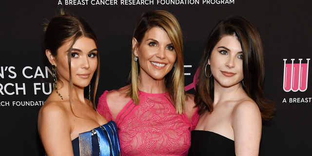 Lori Loughlin's daughters are said to be struggling with both parents in prison.
