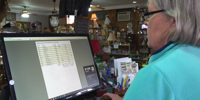 Local business owners in the neighboring towns of Lordstown, Ohio are feeling the impact of the recent closure of the General Motor's plant. Kathleen "KC" Watson reviews her January sales, the lowest on record since she opened three years ago.