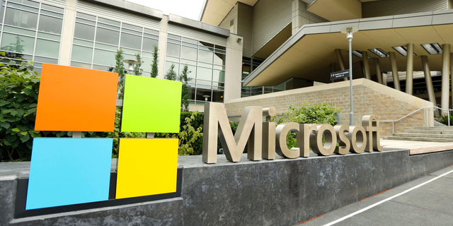 This July 3, 2014 file photo shows Microsoft Corp. signage outside the Microsoft Visitor Center in Redmond, Wash. 