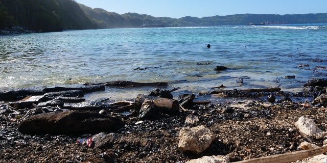 Australian officials say an environmental disaster is unfolding in the Solomon Islands after the ship ran aground and began leaking oil next to a UNESCO World Heritage site.