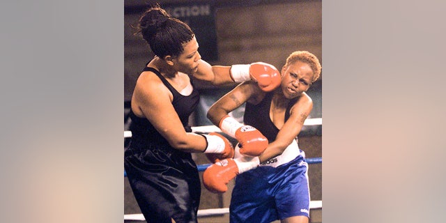 Freeda Foreman, left, daughter of former boxing champion George Foreman, lands a left to the head of LaQuanda Landers, right, in the first round of their pro debuts at the Regent Resort in Las Vegas, June 18, 2000. (John Gurzinski/AFP/Getty Images)