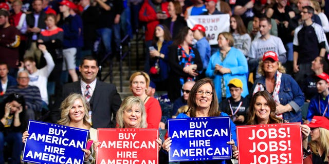 People are waiting for President Donald Trump to speak at a rally in Grand Rapids, Michigan on Thursday, March 28, 2019. (AP Photo / Manuel Balce Ceneta)