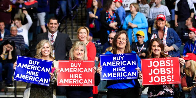 People wait for President Donald Trump to talk at a big event in Grand Rapids, Mich., Thursday, March 28, 2019. (AP Photo / Manuel Balce Ceneta)