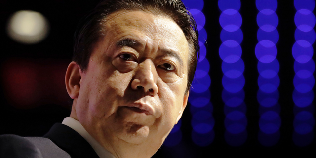 FILE - In this July 4, 2017, file photo, Interpol President Meng Hongwei delivers his opening address at the Interpol World Congress, in Singapore. China has expelled former Interpol chief Meng from public office and the ruling Communist Party. (AP Photo/Wong Maye-E, File)