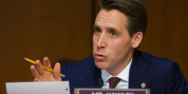 FILE - IN this Jan 15, 2019 file photo, Senate Judiciary Committee committee member Sen. Josh Hawley, R-Mo., questions Attorney General nominee William Barr during a Senate Judiciary Committee on Capitol Hill in Washington. (AP Photo/Carolyn Kaster, File)