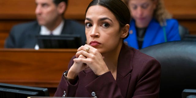 Rep. Alexandria Ocasio-Cortez, D-N.Y., listens to questioning of Michael Cohen, President Donald Trump's former personal lawyer, at the House Oversight and Reform Committee, on Capitol Hill in Washington, Wednesday, Feb. 27, 2019. (AP Photo/J. Scott Applewhite)