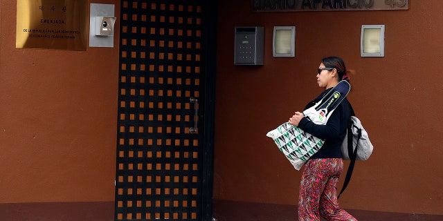 A woman walks past North Korea's embassy in Madrid, Spain, Thursday, Feb. 28, 2019.