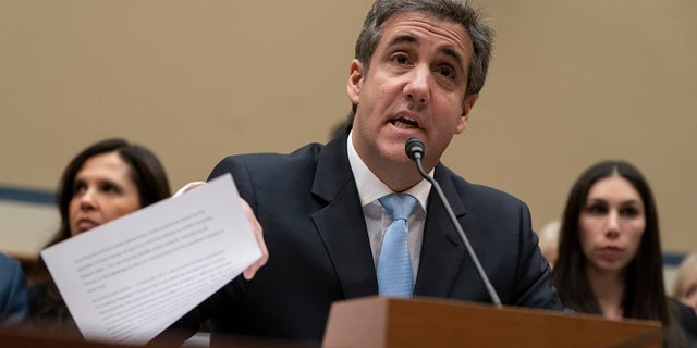 Michael Cohen reads an opening statement as he testifies before the House Oversight and Reform Committee on Capitol Hill in Washington on Feb. 27, 2019. (AP Photo/J. Scott Applewhite, File)