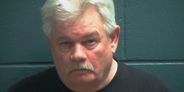 Douglas Kluth is facing at least his 10th drunken driving charge. Authorities allege he had an open beer on the center console of his car. (Oconto County Jail via AP)
