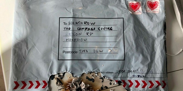 This photo dated Tuesday March 5, 2019, issued by Britain's Metropolitan Police, shows a suspect package after it ignited, sent to Heathrow Airport, one of three packages being treated as a linked series by Britain’s counter-terrorism police.