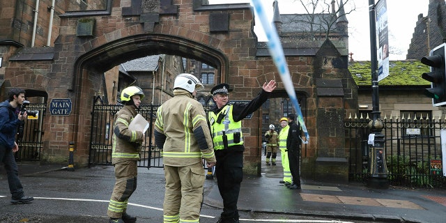 Police and fire services outside the University of Glasgow after the building was evacuated when a suspect package was found in the mailroom, in Glasgow, Scotland, Wednesday March 6, 2019. Buildings at the University of Glasgow were evacuated Wednesday as police examined a suspicious package found in the mailroom, a day after three London transport hubs received letter bombs.