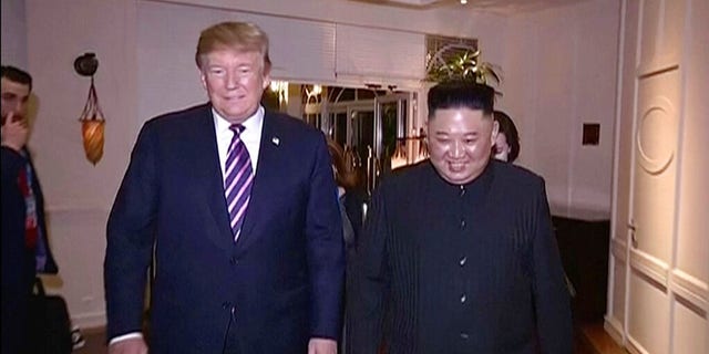 In this image made from video released on Wednesday, March 6, 2019, by North Korean broadcaster KRT, North Korean leader Kim Jong Un, right, smiles while walking with U.S. President Donald Trump for a meeting in Hanoi, Vietnam.