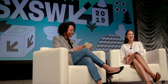 Rep. Alexandria Ocasio-Cortez, right, D-New York, speaks with Briahna Gray, a senior politics editor at The Intercept, during South by Southwest on Saturday, March 9, 2019, in Austin, Texas. (Nick Wagner/Austin American-Statesman via AP)