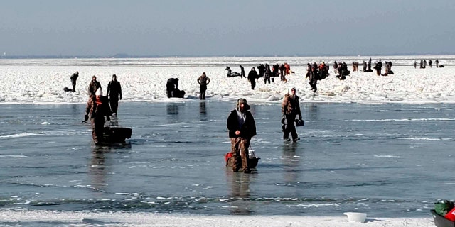 Some of the ice fishermen made it back to shore “by swimming or walking on ice-bridges,” the Coast Guard confirmed.