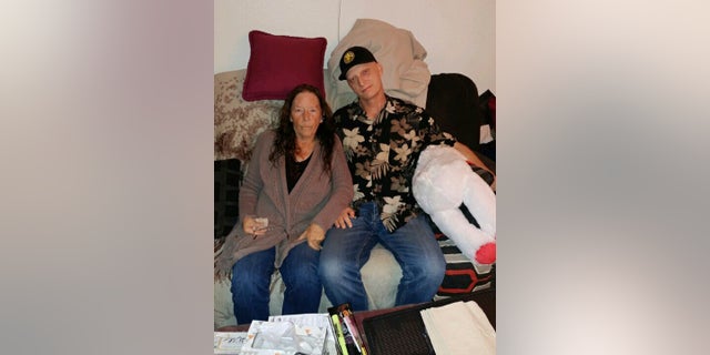 White is seen with his mother, Joanne White, in a photo released by his laywer Mark Zaid. (White family via AP)