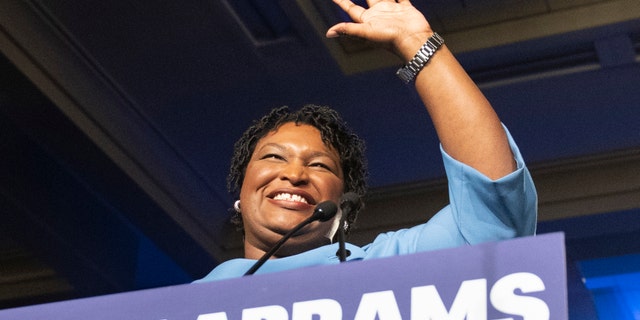 In this Nov. 6, 2018 file photo, former Georgia Democratic gubernatorial candidate Stacey Abrams speaks to supporters in Atlanta. (AP Photo/John Amis)