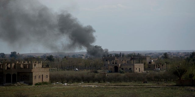 Smoke rises from a strike on Baghouz, Syria, on the Islamic State group's last piece of territory on Friday, March 22, 2019. (AP Photo/Maya Alleruzzo)