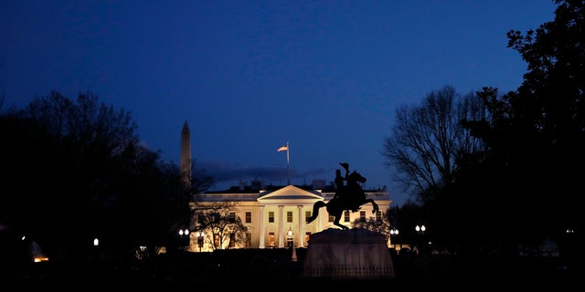 The White House is seen at dusk, Friday March 22, 2019, in Washington, after news broke that the special counsel Robert Mueller has concluded his investigation into Russian election interference and possible coordination with associates of President Donald Trump. The Justice Department says Mueller delivered his final report to Attorney General William Barr, who is reviewing it. (AP Photo/Jacquelyn Martin)
