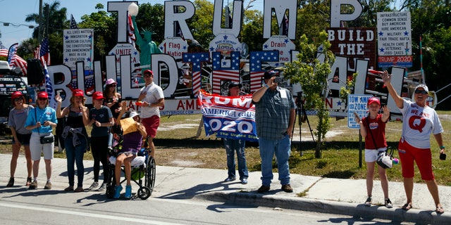 Supporters of President Donald Trump are seen from the media van in the motorcade accompanying the president in West Palm Beach, Fla., Saturday, March 23, 2019, en route to Mar-a-Lago in Palm Beach, Fla. (AP Photo/Carolyn Kaster)