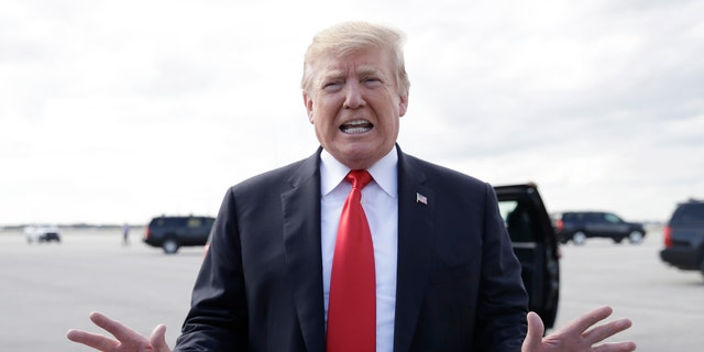 President Donald Trump boards Air Force One, Sunday, March 24, 2019, at Palm Beach International Airport, in West Palm Beach, Fla., en route to Washington. (AP Photo/Carolyn Kaster)