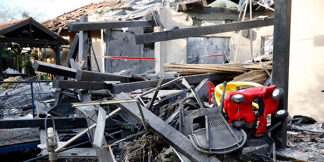 A house lies in ruins after being hit by a rocket in Mishmeret, central Israel, Monday, March 25, 2019. An early morning rocket from the Gaza Strip struck a house in central Israel on Monday, wounding six people, including one moderately, an Israeli rescue service said, in an eruption of violence that could set off another round of violence shortly before the Israeli election. (AP Photo/Ariel Schalit)