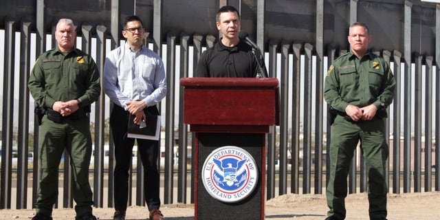 Customs and Border Protection Commissioner Kevin McAleenan, center, announced that the Trump administration will temporarily reassign several hundred border inspectors during a news conference at the border in El Paso, Texas on Wednesday. (AP Photo/Cedar Attanasio)
