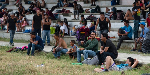 Central American migrants, part of the caravan hoping to reach the U.S. border, take a break in Acacoyagua, Chiapas State, Mexico, Thursday, March 28, 2019. A caravan of about 2,500 Central Americans and Cubans is currently making its way through Mexico's southern state of Chiapas. (AP Photo/Isabel Mateos)