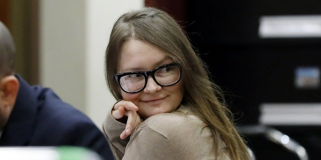 Anna Sorokin sitting at the defense table during her grand larceny trial in New York City for ripping off friends and businesses. 