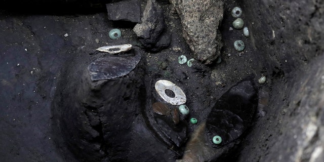The 500-year-old interior of a stone box shows an Aztec offering including a set of black flint knives decorated to represent warriors with carved pearl, jade and green stone and used by priests in ritual sacrifices, in Mexico City, Mexico March 14, 2019.