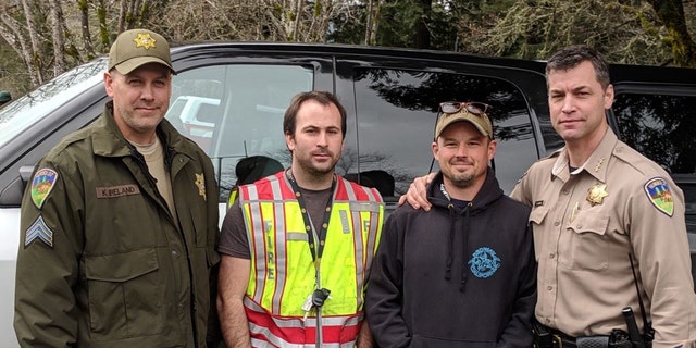 Delbert Chumley (right center) and Abram Hill (left center) from Piercy Volunteer Fire found Leia and Caroline 1.4 miles southeast of their Benbow home. They are seen in this photo released Sunday with Sgt. Kerry Ireland (left) and Sheriff William Honsal (right).