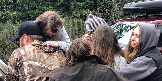 Caroline and Leia Carrico are reunited with family members in this photo released by the Humboldt County Sheriff's Office.