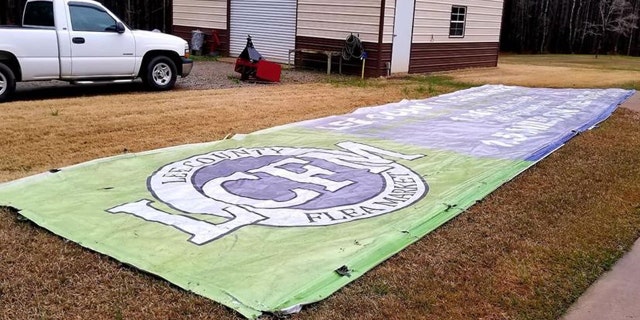 The Lee County Flea Market sign ended up in a yard in Hamilton, Georgia, located 20 miles away from the billboard it was located on.