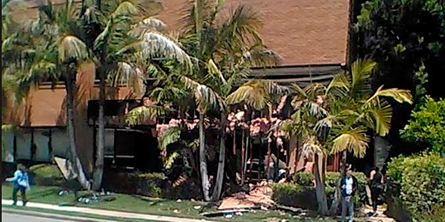 FILE - This May 15, 2018, file image taken from cellphone video shows a building after a fatal explosion in Aliso Viejo, Calif.