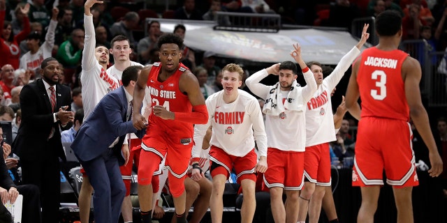 Ohio State bench celebrate after Andre Wesson (24) scores a 3-point shot during the second half of an NCAA college basketball game against Michigan State in the quarterfinals of the Big Ten Conference tournament, Friday, March 15, 2019, in Chicago. (AP Photo/Nam Y. Huh)