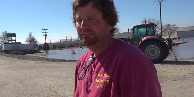Chad Ottmann surveying the damage to his property after the Missouri River sent water rushing through his businesses. (Fox News/Charles Watson)